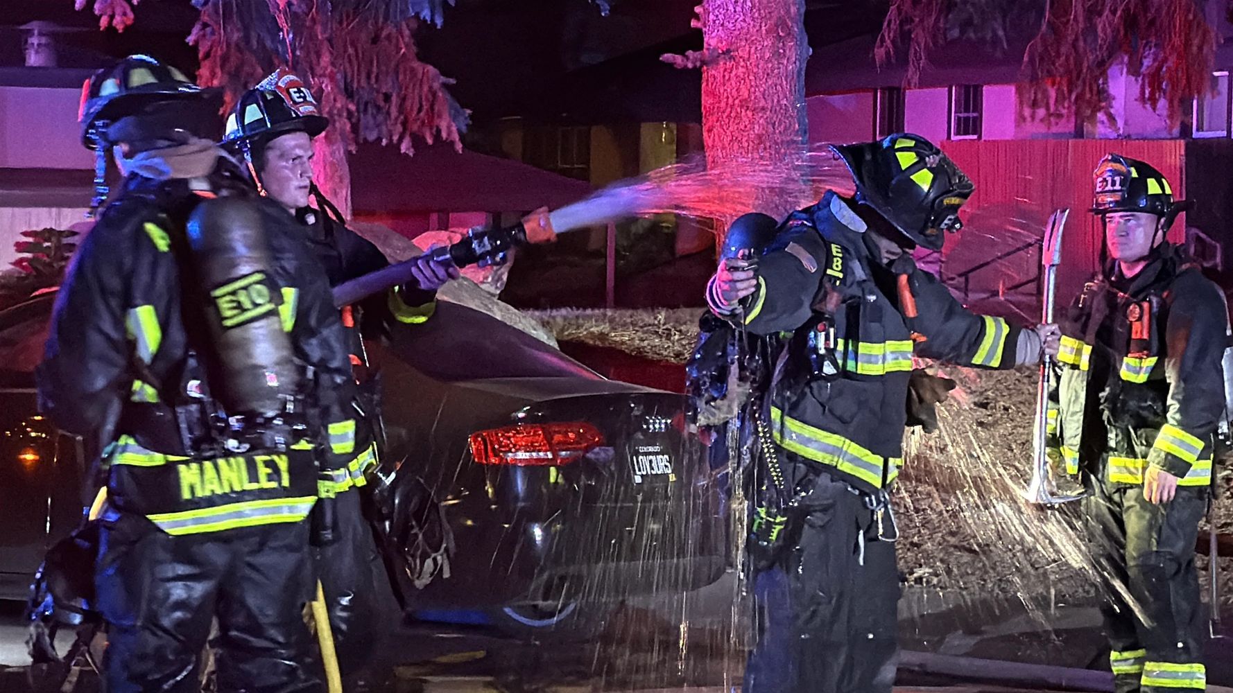 Aurora Firefighters cool of on an extremely hot evening while fighting a structure fire.