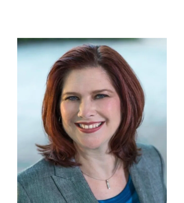 Headshot of Racquel Roberts in a professional suit and a smile on her face.