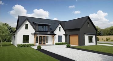 Modern farmhouse with black metal roof and white brick exterior.