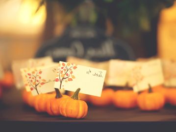 Mini-pumpkins make perfect place card holders for your dinner party or event.
