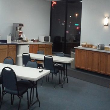 The event space at resort showing cabinets and countertops and tables and chairs