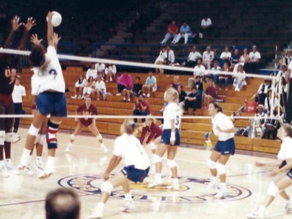 Lynn as a Cal Golden Bear spiking against USC.