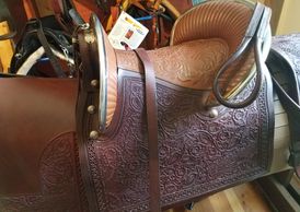 Beautiful hand carved leather! Some of the silver is sterling or coin silver. Leather under pad is a