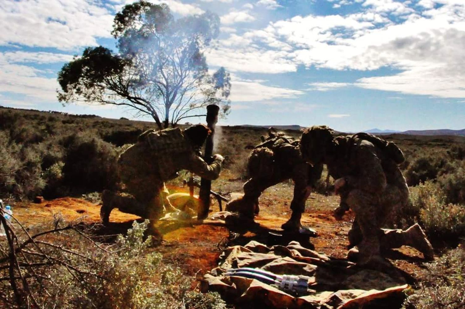 Soldiers operating a mortar in a dry, open landscape under a partly cloudy sky.
DVA claim assistance. Veteran support. Impairment claims. DVA gold card. DVA white card. Pay out.