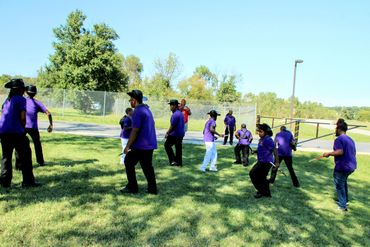 a group of people playing frisbee
