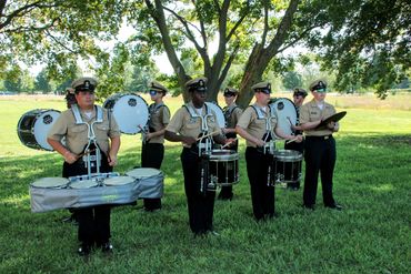 a group of people at an event playing drums