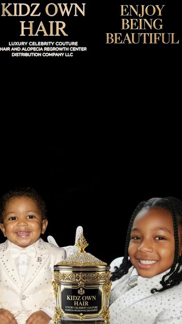 Two children smiling with a luxury hair care product between them.
