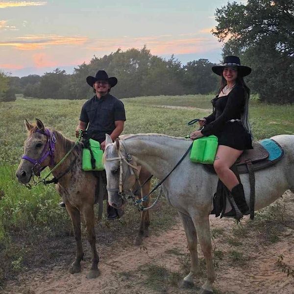 Private couple’s sunset horseback ride on a scenic Texas ranch at Chisholm Trail Rides.