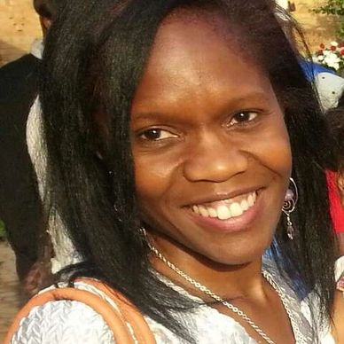 Close up image of a girl smiling at he camera