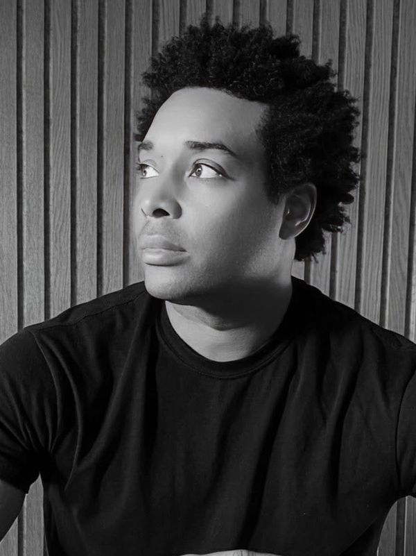Black and white portrait of a man looking to the side.
