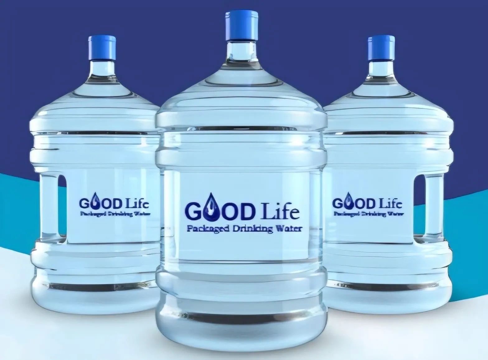 Three large water bottles labeled GOOD Life packaged drinking water.