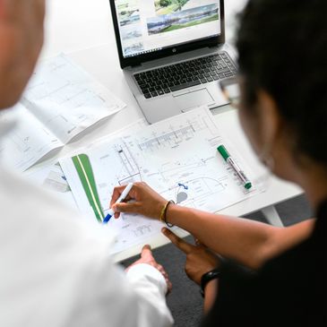 Two engineers working on some plans
