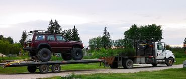 Owner hauling jeep to local tough truck challenge