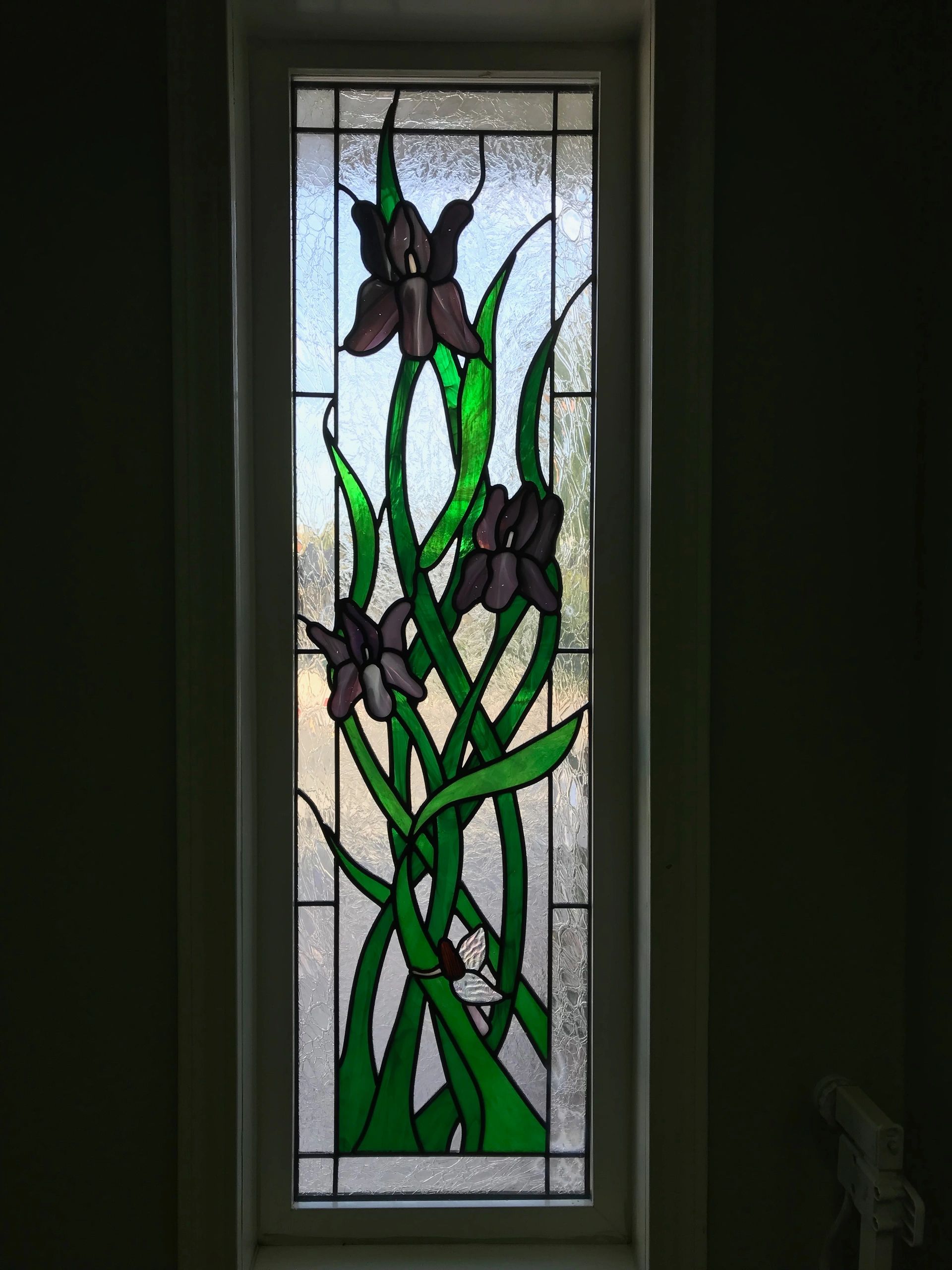 Leaded Glass window of Iris' with a peaking fairy in it.