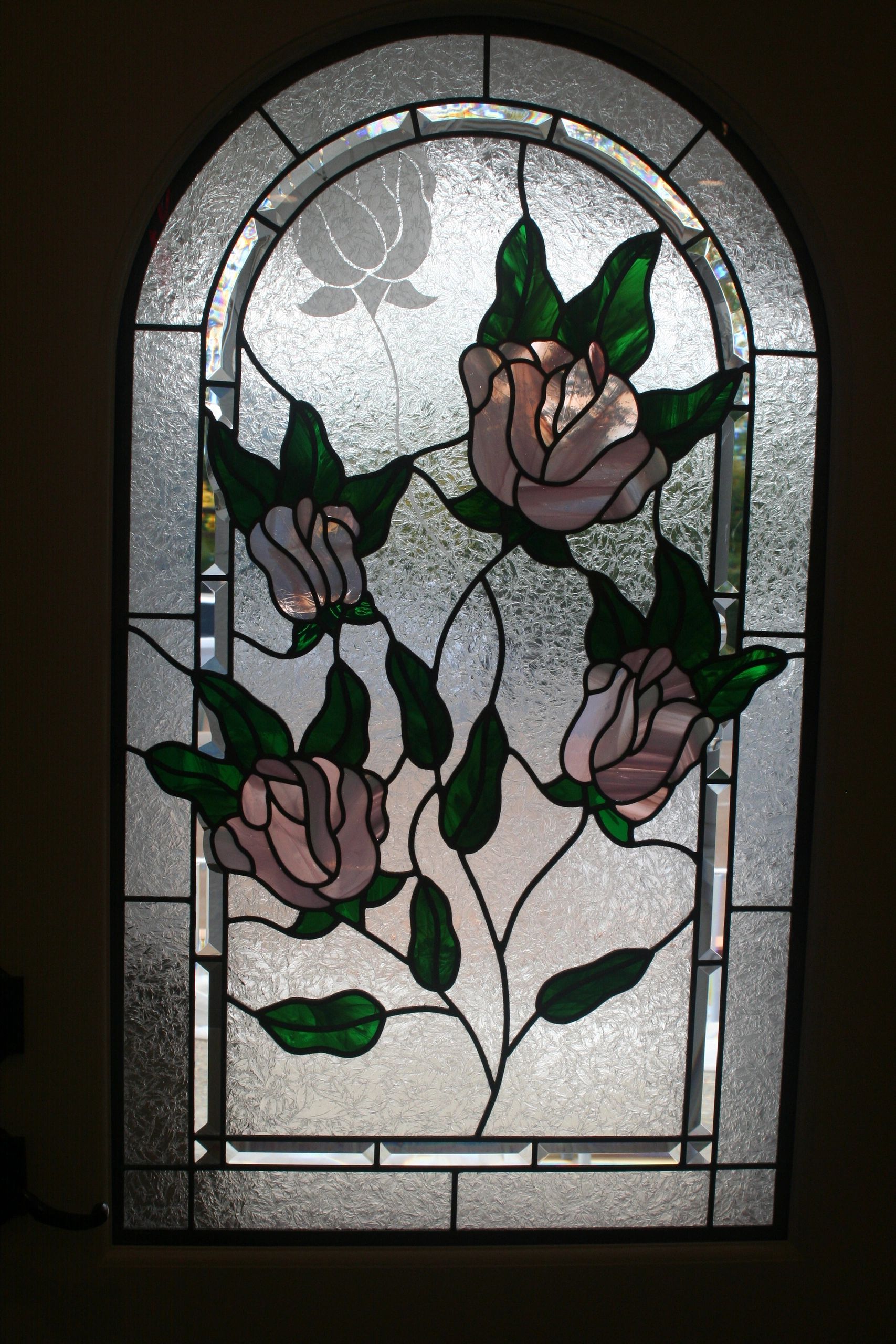 Symbolic Leaded Glass door window.  This window symbolises a family and the deceased mother.  
