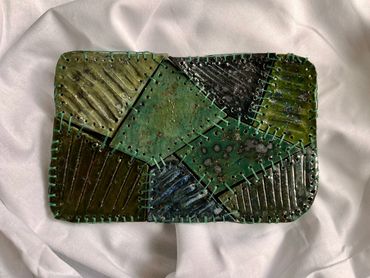 'Untitled work', 25x18cm, ceramic and embroidery floss, 2026 by Roisín O'Connor, Ireland.