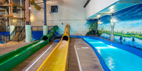 waterslides and lazy river in indoor waterpark
