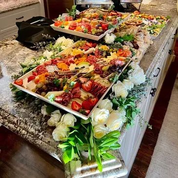 Colorful food display with flowers.