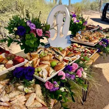 Outdoor buffet with floral decorations.
