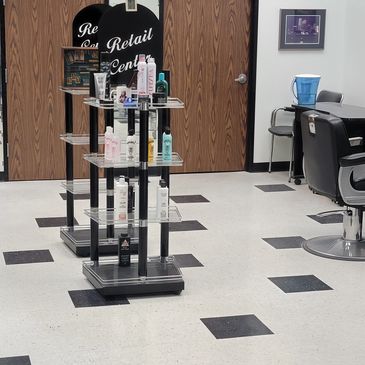 Hair care products displayed on a stand in a salon.