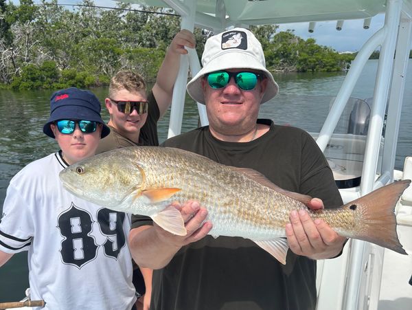 family fishing for redfish in st pete florida