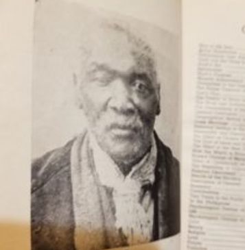 Black and white photo of a man with text