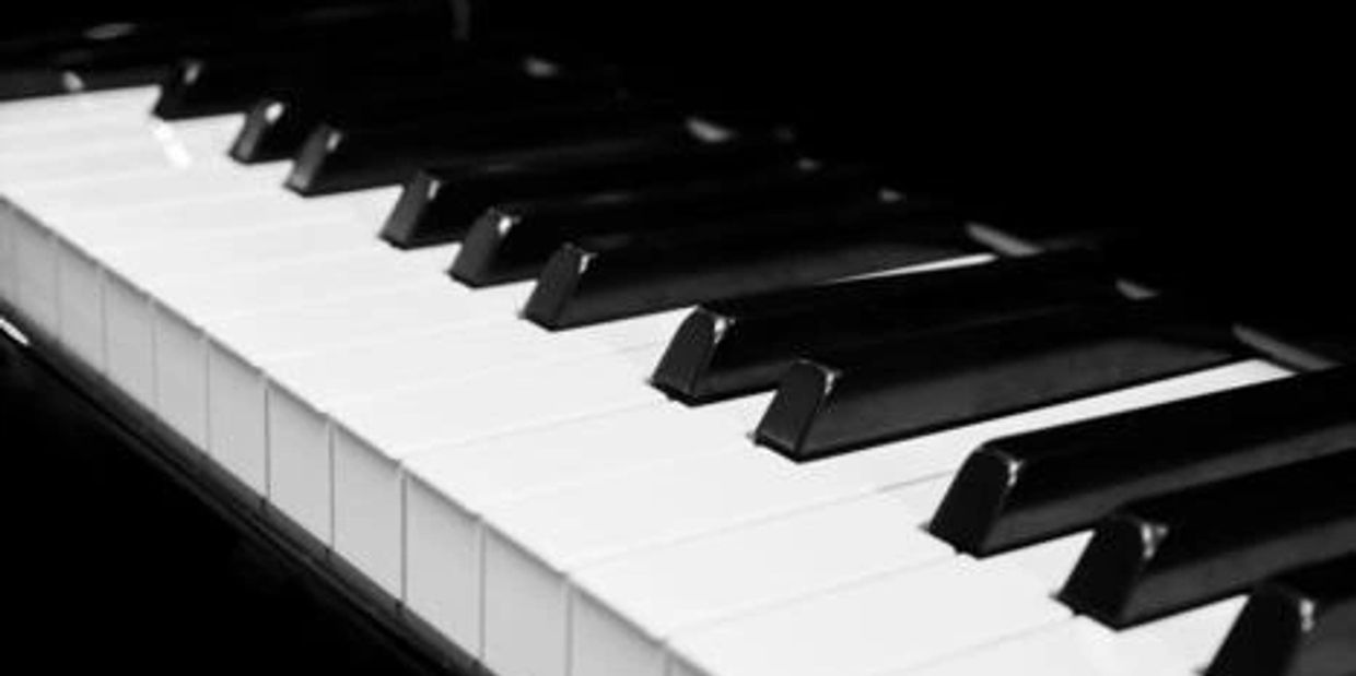 Close-up of piano keys showing black and white keys.