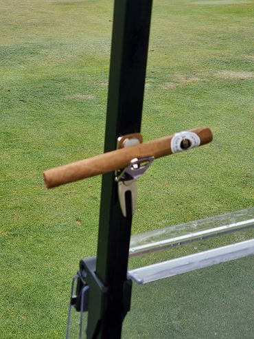 Silver magnetic cigar holder.