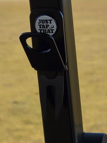 Black magnetic divot tool cigar holder.