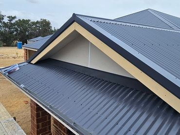 Metal roof panels on a building under construction.