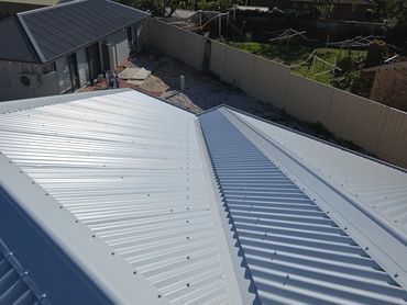 Newly installed clean metal rooftop on a house.