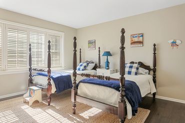 Garden Cottage light-filled twin room with plantation shutters and huge windows