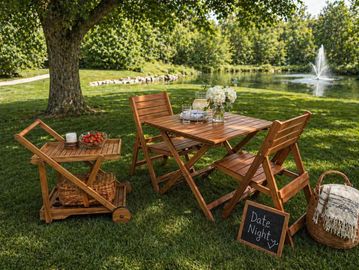 Cozy outdoor wooden table and chairs set for a date night by the pond.