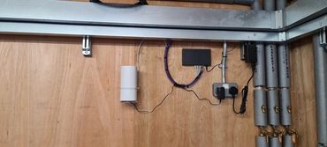 Starlink internet via cat6 data cabling to the customers pumphouse, serving EV car charging points &