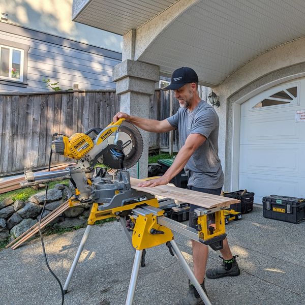 One of our team members posing for a photo at a job site.