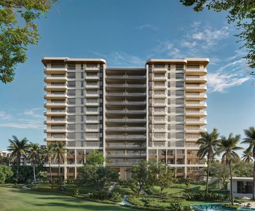 Front of Solea high-rise residential towers surrounded by palms & landscaped gardens in Punta Cana