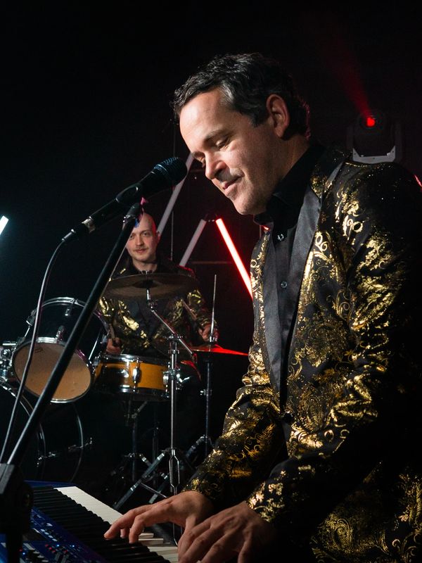 A photo of the band Re-Release performing live.