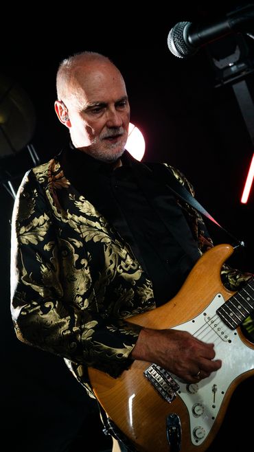 A photo of the band Re-Release performing live.