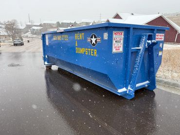 Our 22-yard roll off dumpster side street