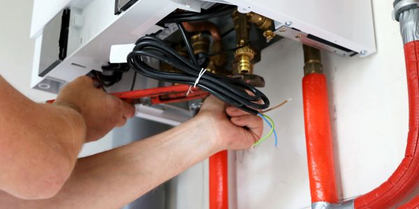 Person installing a gas boiler