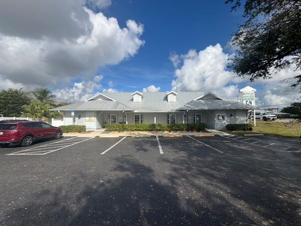 Single-story commercial building with a parking lot.