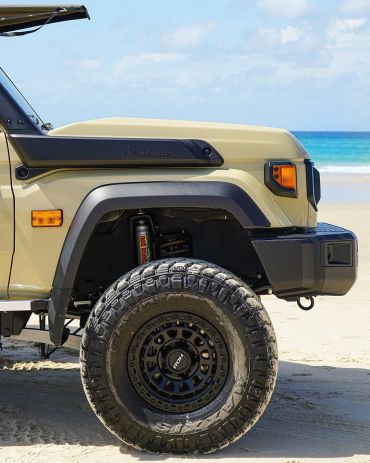 THE RIGHT HAND FRONT WHEEL OF A 79 SERIES LANDCRUISER WITH TOUGH DOG FOAM CELL SHOCK ABSORBERS INSTA