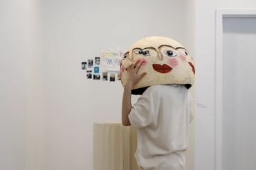 Person interacting with work by Sherly Fan.