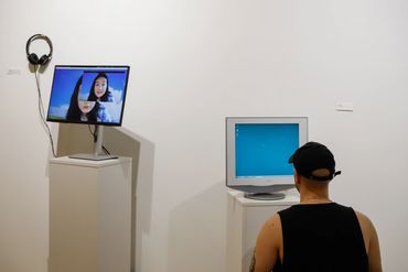Spectator interacting with Sherly Fan's artwork.