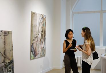 Yanxiu Luo and opening reception guest.