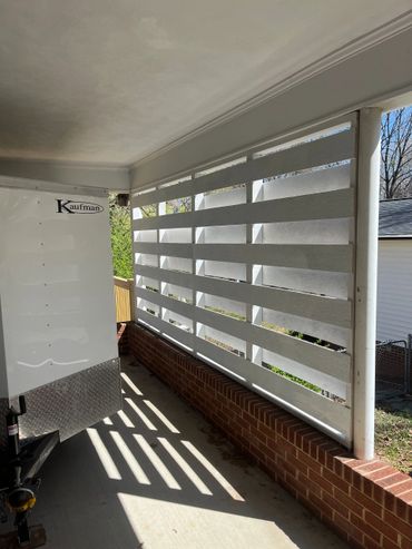 Custom built side awning for outdoor storage and privacy.