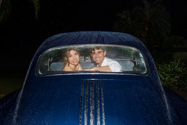 Bride and groom in getaway car