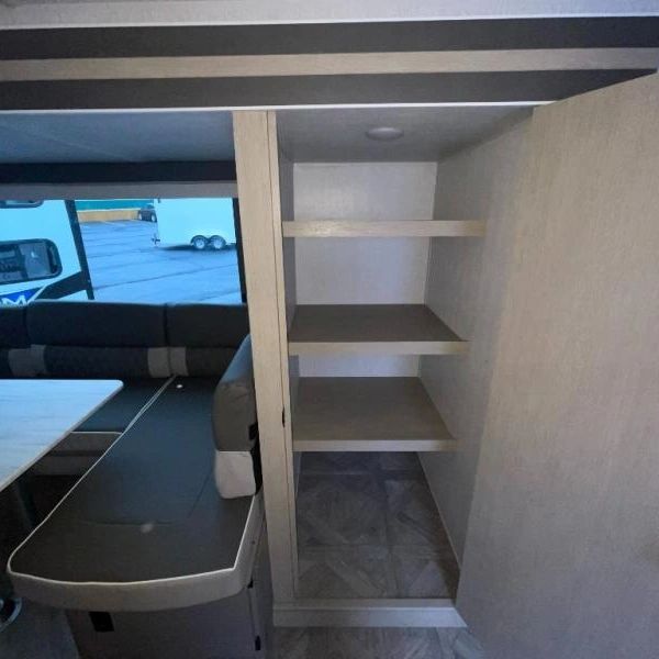 Photo showing spacious walk-in pantry from front door entry vantage point.