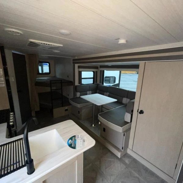 Photo showing overview of kitchen and dinette area from front door.