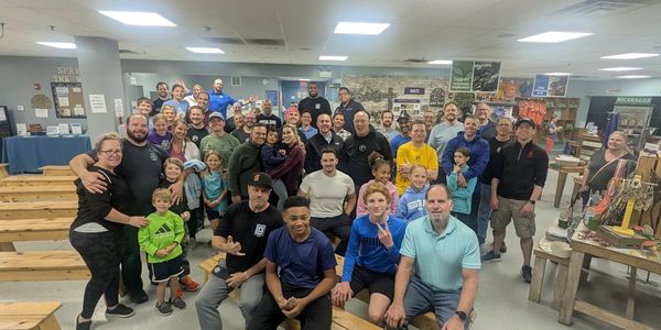A large group of volunteers after a meal-packing shift at Feed My Starving Children
